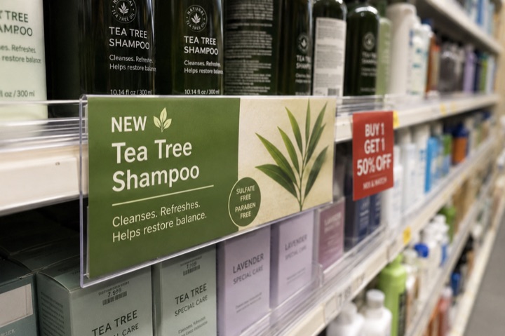 Custom shelf signage on retail shelves highlighting promotions