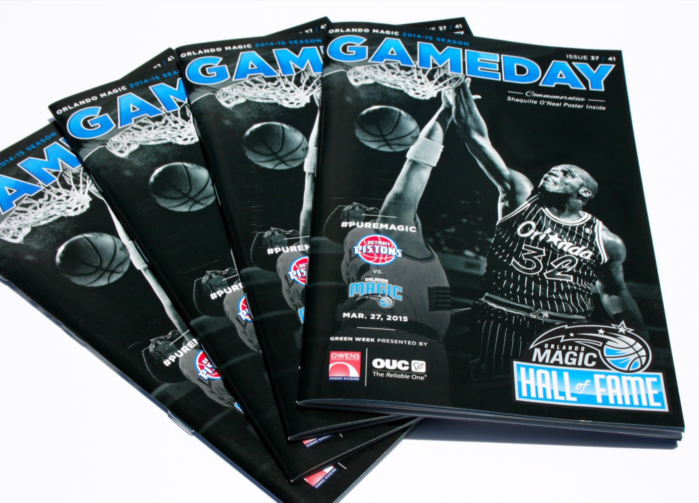 A stack of saddle-stitched game day programs