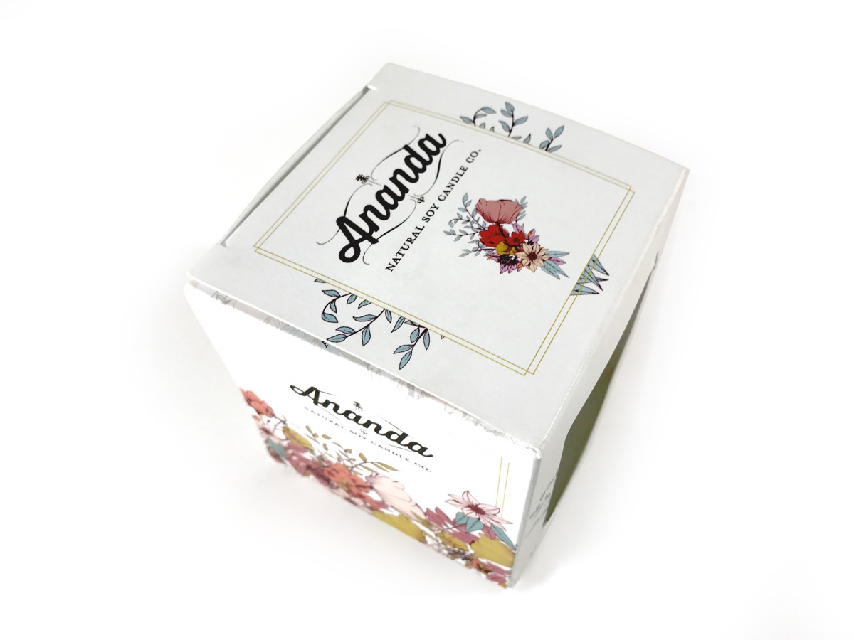 A printed folding carton for a candle brand