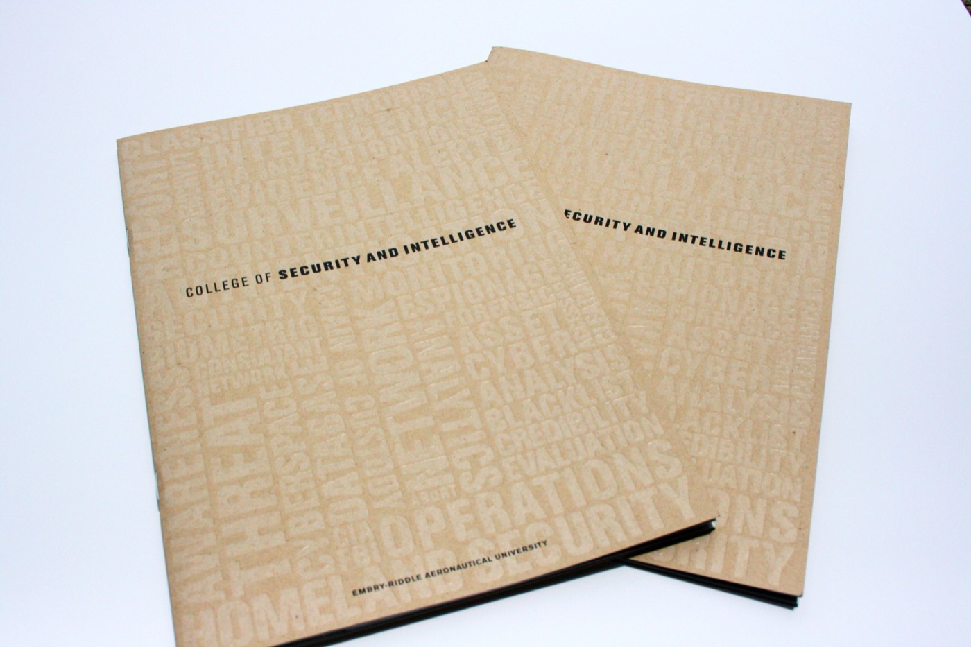 Two kraft covers with a blind embossed word cloud