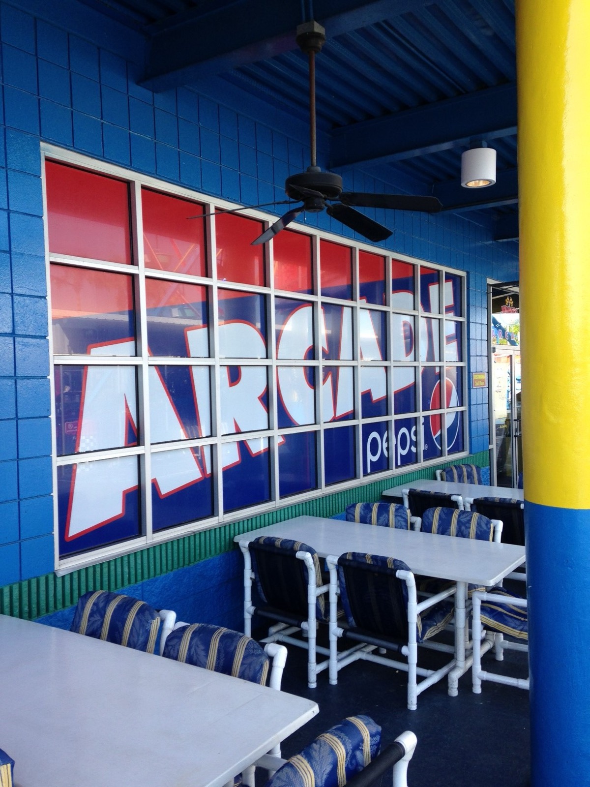 A printed wall graphic in an arcade dining room