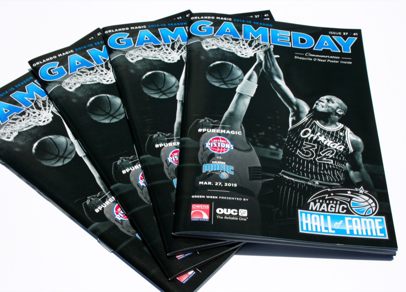 A stack of saddle-stitched game day programs
