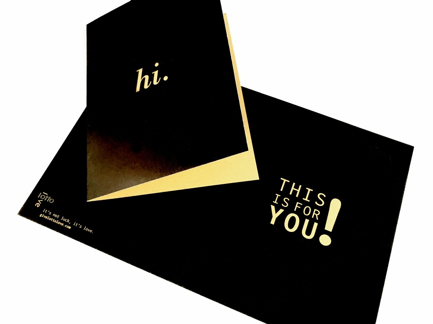 A black and gold card with a foil panel