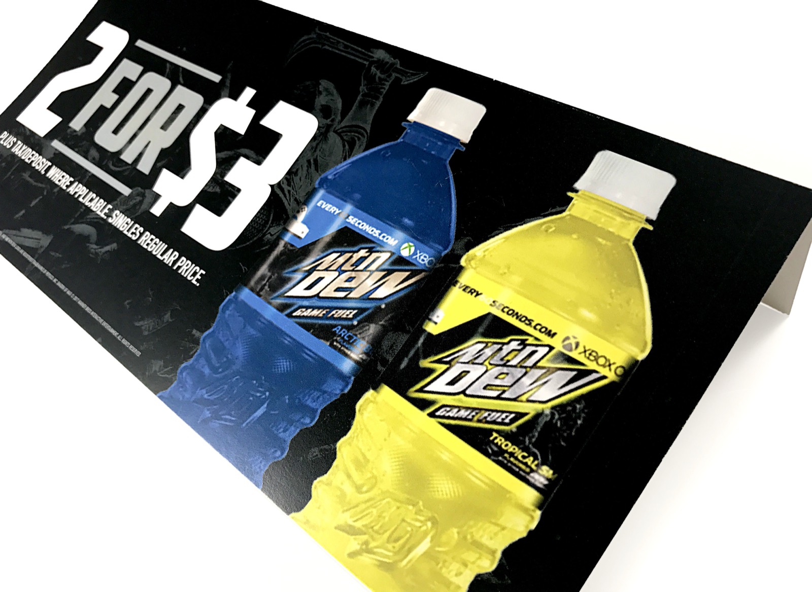 A printed point of sale sign for a Mountain Dew multipack offer