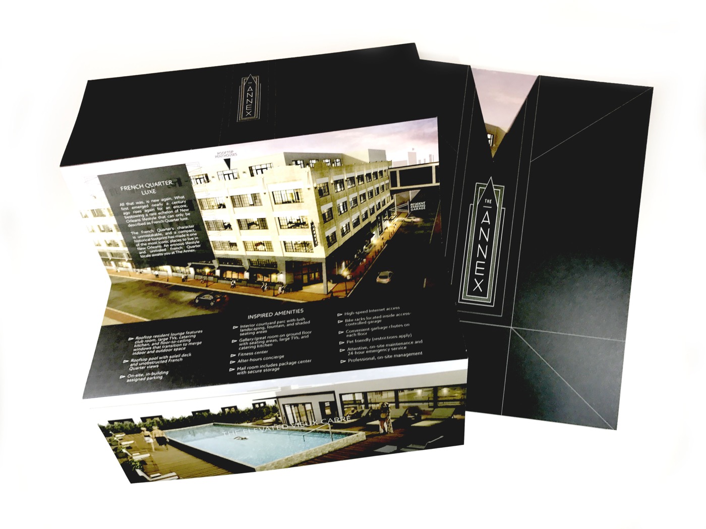 A black gatefold brochure with a pocket